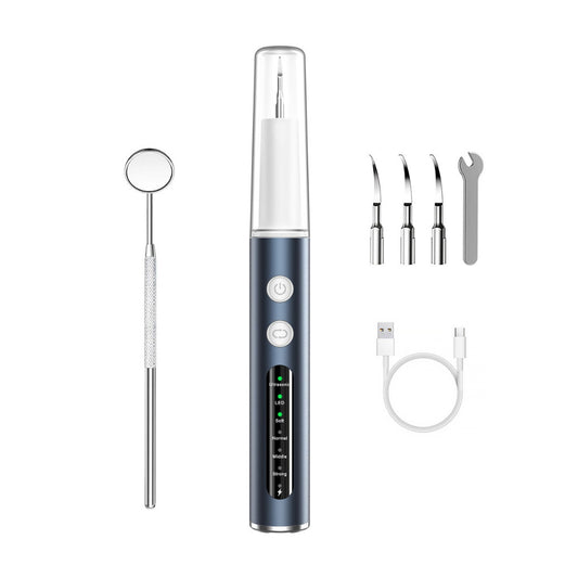 Dental tool set with a central device, mirror, probe, and other attachments on a white background.