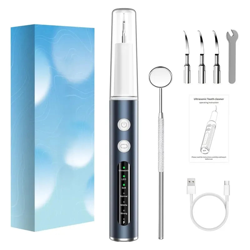 Ultrasonic portable dental calculus cleaner with accessories and packaging on a white background