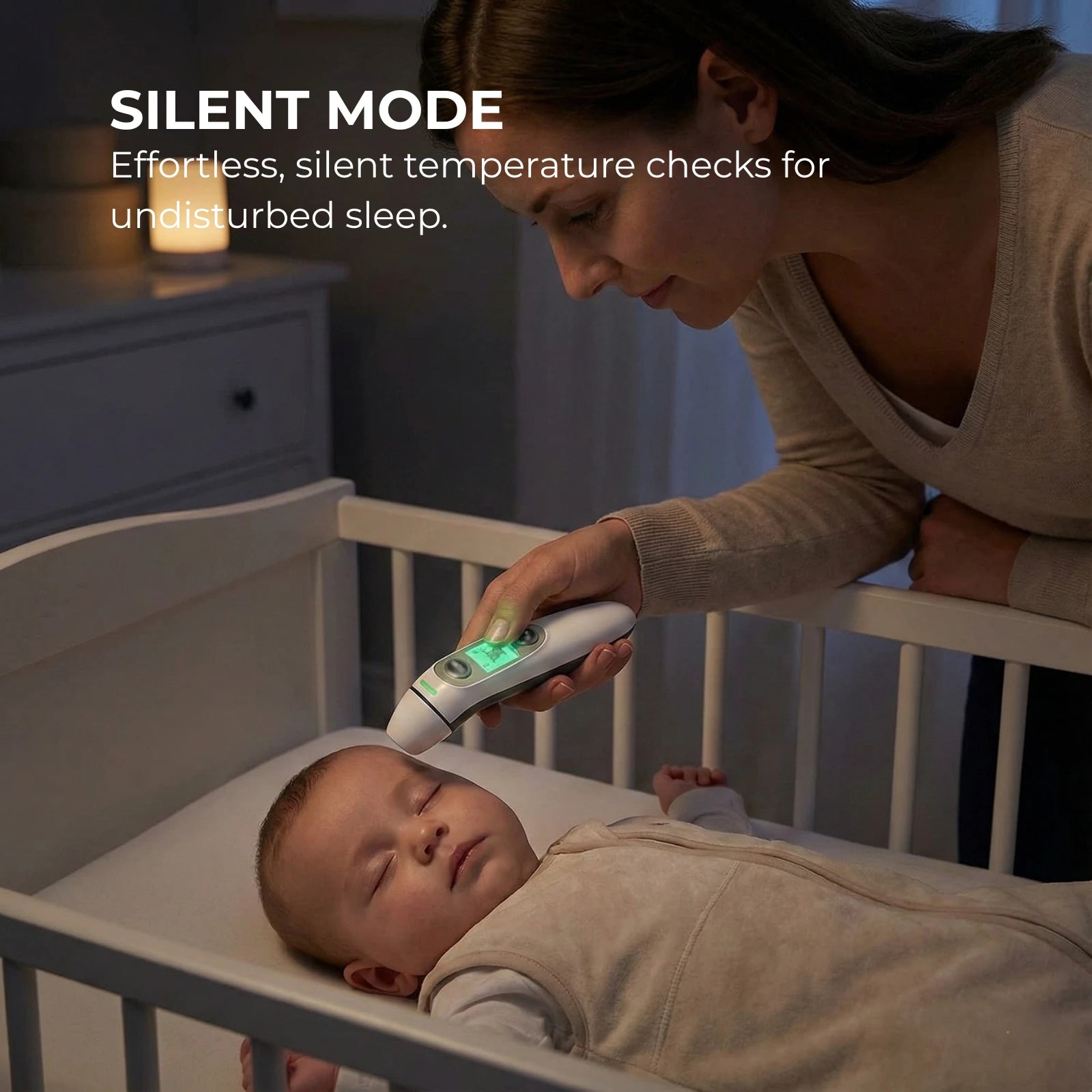 Woman using a digital thermometer on a baby in a crib with text about silent mode.
