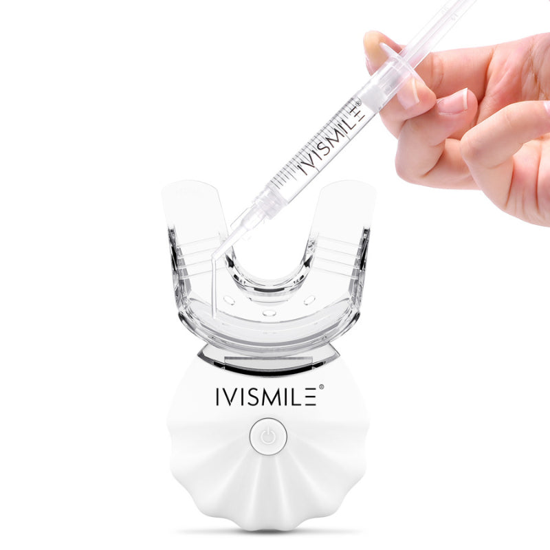 IVISMILE dental device with a hand holding a syringe on a white background