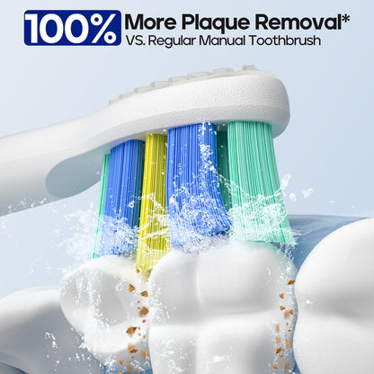 Electric toothbrush head with colourful bristles cleaning teeth against a light blue background