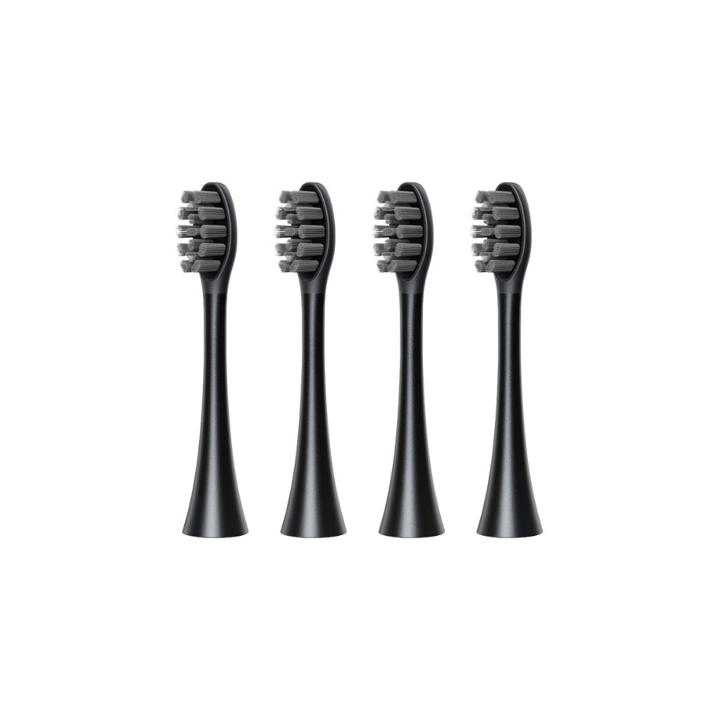 Four black electric toothbrush heads on a white background
